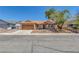 Charming single-story home with a well-maintained front yard and a two-car garage at 6112 Blossom Knoll Ave, Las Vegas, NV 89108