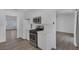 Bright kitchen features white cabinets, stainless steel appliances, and new floors at 6112 Blossom Knoll Ave, Las Vegas, NV 89108