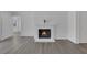 Inviting living room featuring a brick fireplace, gray floors, and white trim at 6112 Blossom Knoll Ave, Las Vegas, NV 89108