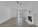 Bright living room boasts a fireplace, sliding glass doors, and neutral decor at 6112 Blossom Knoll Ave, Las Vegas, NV 89108