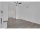 Spacious living room with high ceilings, ceiling fan, and modern gray floors at 6112 Blossom Knoll Ave, Las Vegas, NV 89108