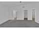 Bright main bedroom with neutral carpet and vaulted ceiling. Leads to a walk-in closet at 6112 Blossom Knoll Ave, Las Vegas, NV 89108