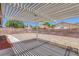 Covered patio with ample shade, overlooking a spacious backyard with room for outdoor enjoyment at 6112 Blossom Knoll Ave, Las Vegas, NV 89108