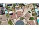 Aerial view of a property with a well-manicured backyard and mature trees at 636 Pacific Cascades Dr, Henderson, NV 89012