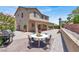 Stunning backyard with a patio and barbecue featuring a round table with place settings at 636 Pacific Cascades Dr, Henderson, NV 89012