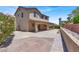 Backyard with desert landscaping, block wall, and a peek at the back of the house at 636 Pacific Cascades Dr, Henderson, NV 89012