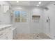 A bright and clean bathroom featuring a tiled shower with a glass enclosure at 636 Pacific Cascades Dr, Henderson, NV 89012