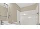 White bathroom featuring shower-tub combo with tiled surround and chrome fixtures at 636 Pacific Cascades Dr, Henderson, NV 89012