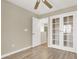 Bedroom with light-toned walls, wood-look floors, and an open door and closet at 636 Pacific Cascades Dr, Henderson, NV 89012