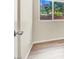 Bedroom with wood floors and minimal finishes, and a view of outdoor greenery at 636 Pacific Cascades Dr, Henderson, NV 89012
