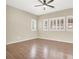 Bright bedroom with wood floors and shuttered windows, offering ample natural light and a comfortable space at 636 Pacific Cascades Dr, Henderson, NV 89012
