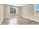 Bedroom boasts natural light, complemented by wood floors and neutral wall color at 636 Pacific Cascades Dr, Henderson, NV 89012
