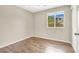 Bedroom features hardwood floors, natural light, and simple finishes at 636 Pacific Cascades Dr, Henderson, NV 89012