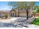 Inviting two-story home featuring a spacious driveway and a two-car garage at 636 Pacific Cascades Dr, Henderson, NV 89012