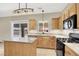 Bright eat-in kitchen offering stainless steel appliances, island and granite countertops at 636 Pacific Cascades Dr, Henderson, NV 89012
