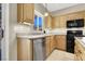 Traditional kitchen with light wood cabinets, stainless steel appliances, and granite countertops at 636 Pacific Cascades Dr, Henderson, NV 89012