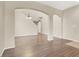 Bright and airy living space with hardwood floors, offering a seamless transition to dining area and other rooms at 636 Pacific Cascades Dr, Henderson, NV 89012