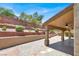 Covered patio with a ceiling fan and a view of the terraced garden at 636 Pacific Cascades Dr, Henderson, NV 89012
