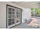 Back porch with tile, French doors, and white exterior at 6517 Villa Mesa Dr, Las Vegas, NV 89107