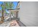 Exterior view showing covered patio, brick walkway, and drought-tolerant landscaping at 6517 Villa Mesa Dr, Las Vegas, NV 89107