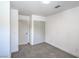 A bright bedroom featuring plush carpeting, closet, and entry to another room at 6517 Villa Mesa Dr, Las Vegas, NV 89107