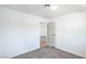 A cozy bedroom featuring plush carpeting, and a view into another room at 6517 Villa Mesa Dr, Las Vegas, NV 89107