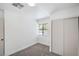 Bedroom featuring neutral carpet, white walls, and natural light from a window at 6517 Villa Mesa Dr, Las Vegas, NV 89107