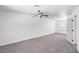 Spacious bedroom features a modern ceiling fan, neutral carpet, and lots of natural light at 6517 Villa Mesa Dr, Las Vegas, NV 89107