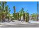 Well-landscaped home with a gravel yard, trimmed shrubs, and a paved driveway at 6517 Villa Mesa Dr, Las Vegas, NV 89107