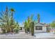 Charming home with mature trees, a well-maintained lawn, and a front driveway at 6517 Villa Mesa Dr, Las Vegas, NV 89107