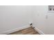 Small, simple laundry area features wood-look floors, white walls, and utility hookups at 6517 Villa Mesa Dr, Las Vegas, NV 89107