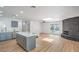 Wide angle shot of the open floor plan featuring a modern kitchen and spacious living area at 6517 Villa Mesa Dr, Las Vegas, NV 89107