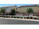 Community pool with lounge chairs and a black fence at 6682 Salt Pond Bay St, Las Vegas, NV 89149