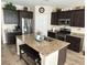 Spacious kitchen with granite countertops, stainless steel appliances, and a convenient center island at 6682 Salt Pond Bay St, Las Vegas, NV 89149