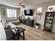 Comfortable living room with a ceiling fan, a large TV, and neutral décor at 6682 Salt Pond Bay St, Las Vegas, NV 89149
