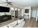 Bright living room with a cozy sectional couch, modern decor, and ample natural light at 6682 Salt Pond Bay St, Las Vegas, NV 89149