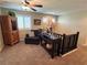 Open loft area with comfy seating, a decorative table, and natural light from shuttered windows at 6682 Salt Pond Bay St, Las Vegas, NV 89149