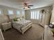 Serene main bedroom with neutral colors, plantation shutters, and carpet flooring at 6682 Salt Pond Bay St, Las Vegas, NV 89149