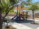 Community playground with shaded play structure, benches, and safety surfacing at 6682 Salt Pond Bay St, Las Vegas, NV 89149