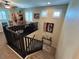 View of a carpeted staircase with wooden railings, leading to the upper level of the home at 6682 Salt Pond Bay St, Las Vegas, NV 89149