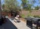 Inviting backyard with a playhouse, patio seating, and a built-in barbecue area, perfect for entertaining at 6867 Dragonfly Rock St, Las Vegas, NV 89148