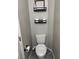 Cozy bathroom featuring a toilet with a bidet, complemented by stylish shelving for storage and decor at 6867 Dragonfly Rock St, Las Vegas, NV 89148