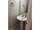 Bathroom featuring a white pedestal sink and modern fixtures at 6867 Dragonfly Rock St, Las Vegas, NV 89148