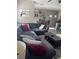 Open-concept living room featuring a comfortable couch and stylish decor at 6867 Dragonfly Rock St, Las Vegas, NV 89148