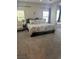 Spacious main bedroom with a cozy seating area, carpeted floors and comfortable king size bed at 6867 Dragonfly Rock St, Las Vegas, NV 89148