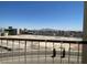 Exterior balcony with wrought iron railing and city views at 745 N Royal Crest Cir # 157, Las Vegas, NV 89169
