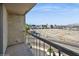 Balcony view featuring city buildings and mountains under a bright blue sky at 745 N Royal Crest Cir # 157, Las Vegas, NV 89169