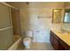 Bathroom featuring a shower-tub, vanity, and tiled floors and walls at 745 N Royal Crest Cir # 157, Las Vegas, NV 89169