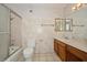 Bathroom featuring a shower-tub combo, toilet and vanity with framed mirror at 745 N Royal Crest Cir # 157, Las Vegas, NV 89169