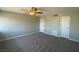 Spacious bedroom featuring neutral paint, ceiling fan, and plush carpeting at 745 N Royal Crest Cir # 157, Las Vegas, NV 89169